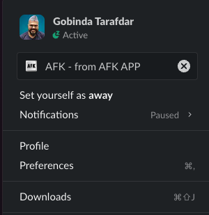 Slack profile menu showing the AFK status set automatically.